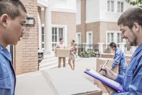 Moving crew preparing a transparent quote for a Westminster apartment relocation