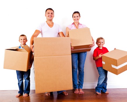 Professional movers handling office equipment during a Westminster move