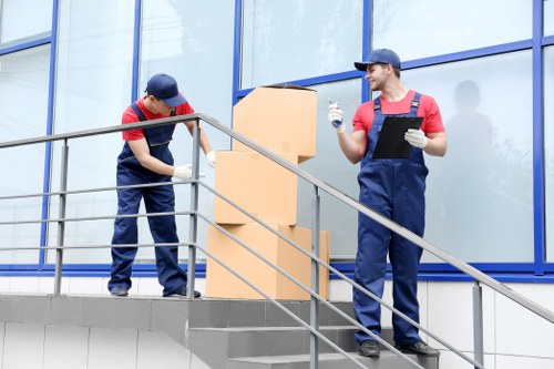 Removal team loading boxes for a house move