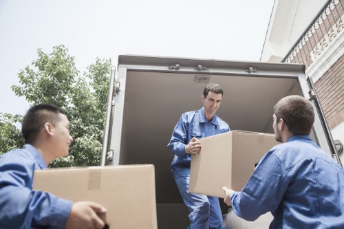Staff handling belongings during a scheduled relocation