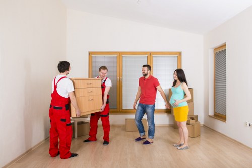 Moving team protecting floors and doorways during a property move