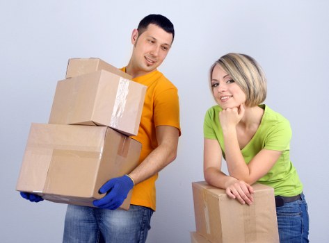 Removal team loading household furniture in Westminster