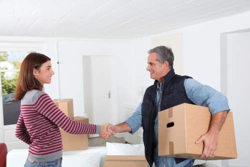 Cardboard, paper, and household items being separated for recycling
