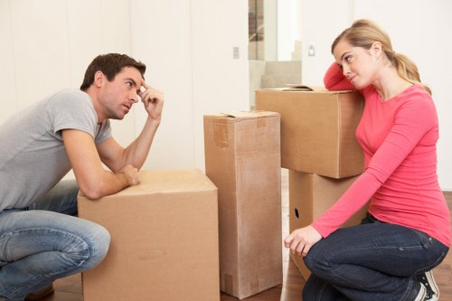 Mover wearing PPE while handling furniture
