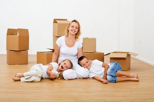 Relocation specialists handling office furniture during a Westminster move