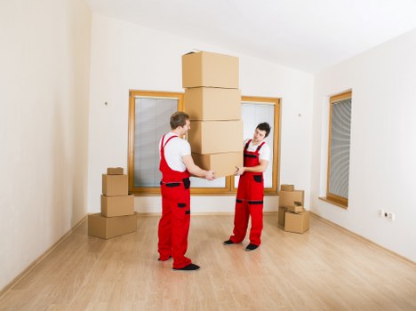 Packed boxes and wrapped furniture ready for flat removals in Westminster